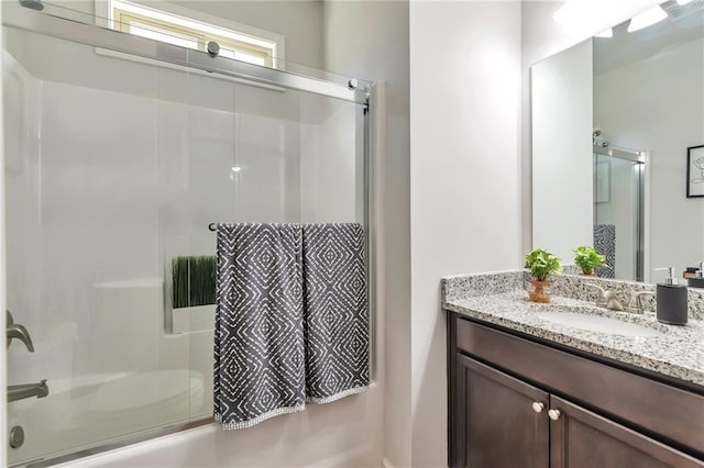 2021 Adam Acres Dr, Lawrenceville, GA 30043 - bathroom featuring shower / bath combination with glass door, vanity, and visible vents