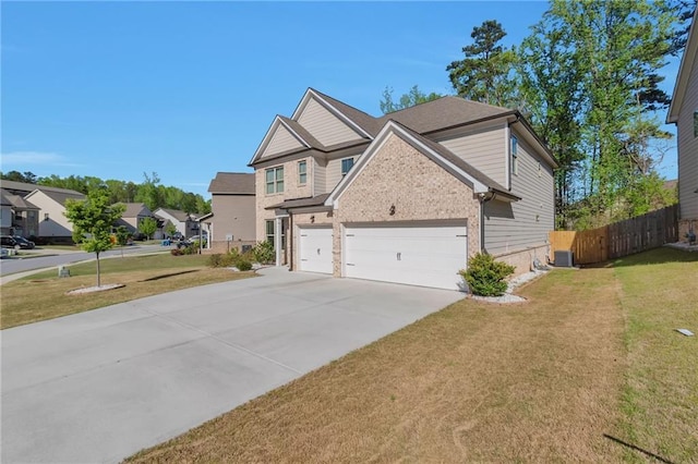 2021 Adam Acres Dr, Lawrenceville, GA 30043 - view of front of property with a front yard, fence, brick siding, concrete driveway, and a residential view