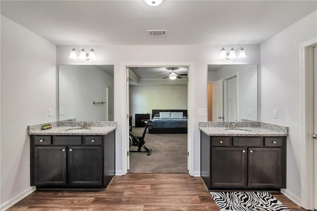 2021 Adam Acres Dr, Lawrenceville, GA 30043 - bathroom featuring ensuite bathroom, visible vents, a sink, and ceiling fan