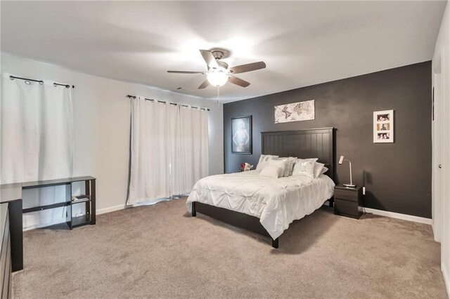 2021 Adam Acres Dr, Lawrenceville, GA 30043 - bedroom with baseboards, a ceiling fan, and carpet