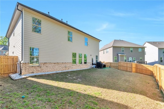 2021 Adam Acres Dr, Lawrenceville, GA 30043 - back of property featuring brick siding, a fenced backyard, and a yard