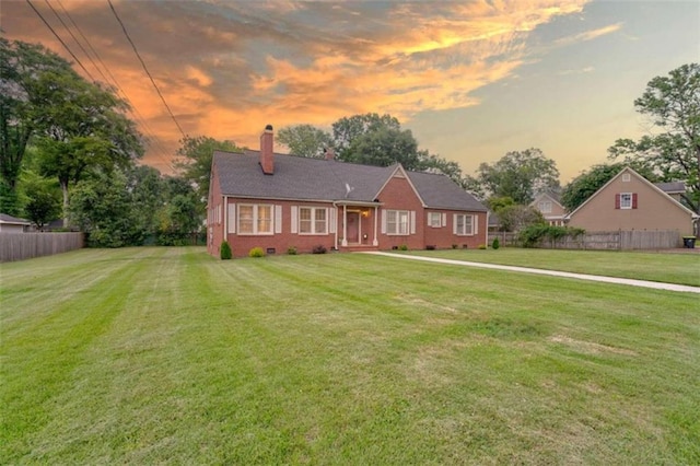 view of front of home featuring a yard