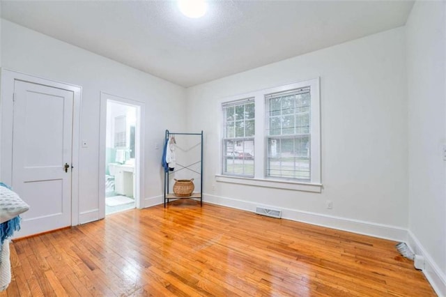 unfurnished room featuring light wood-type flooring