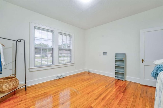 spare room featuring light wood-type flooring