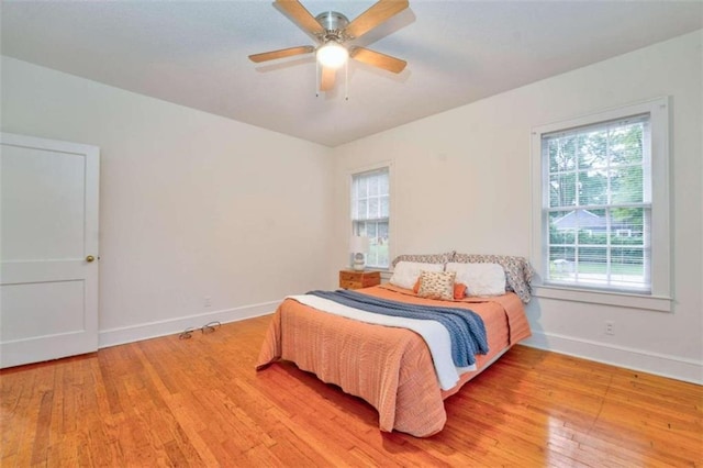 bedroom featuring ceiling fan and light wood-type flooring