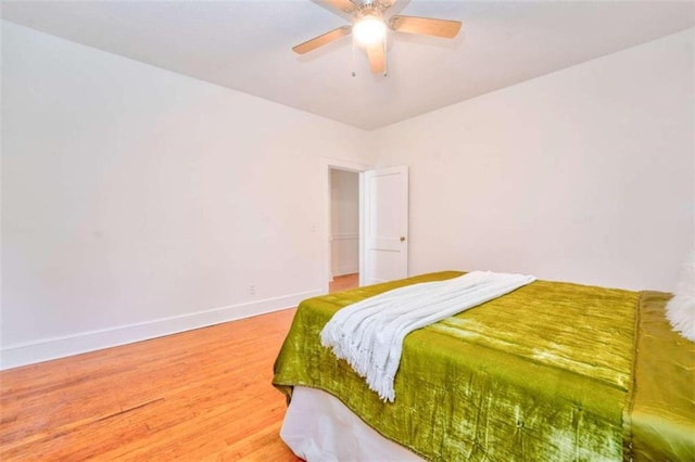 bedroom featuring ceiling fan and hardwood / wood-style flooring