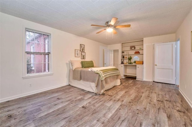 unfurnished bedroom featuring hardwood / wood-style flooring and ceiling fan