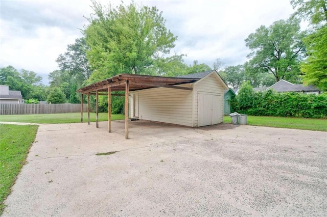 view of car parking with a lawn and a carport