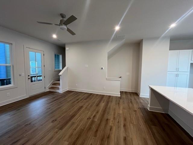 bathroom with hardwood / wood-style floors, vanity, and a shower with shower door