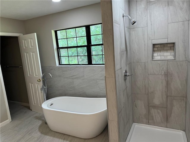 1516 Chase Ct, Riverdale, GA 30296 - bathroom featuring a soaking tub and a tile shower