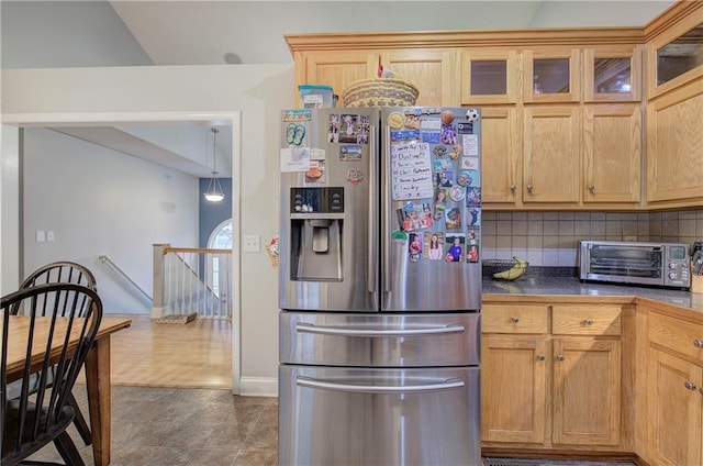 kitchen with tasteful backsplash and stainless steel fridge with ice dispenser