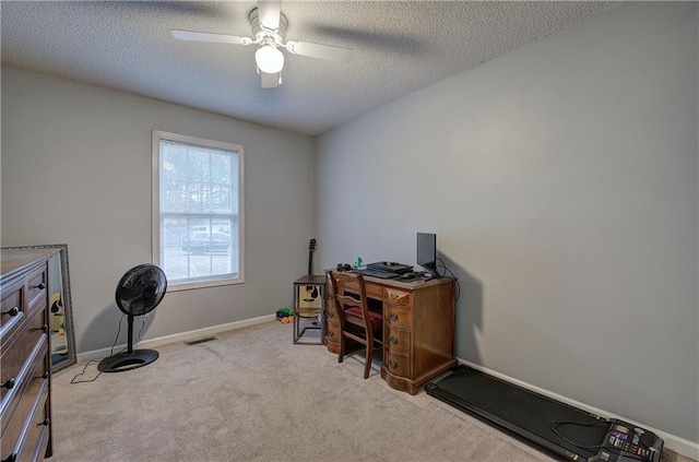 office with ceiling fan, light colored carpet, and a textured ceiling