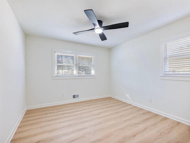 unfurnished room featuring ceiling fan and light hardwood / wood-style flooring