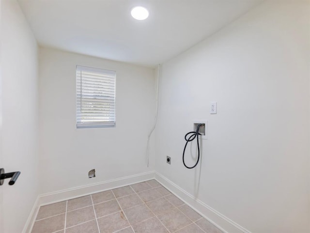 clothes washing area with hookup for a washing machine, light tile patterned flooring, and electric dryer hookup