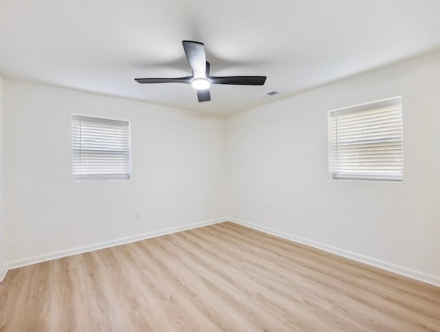 empty room featuring ceiling fan and light wood-type flooring