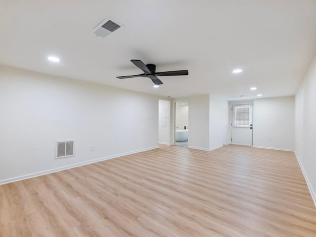 empty room featuring ceiling fan and light hardwood / wood-style floors