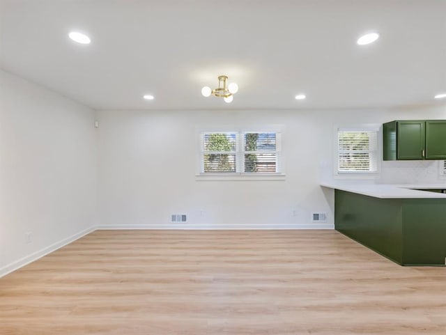 unfurnished dining area featuring light hardwood / wood-style floors