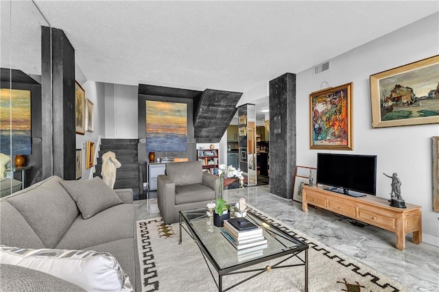 living area with marble finish floor and visible vents