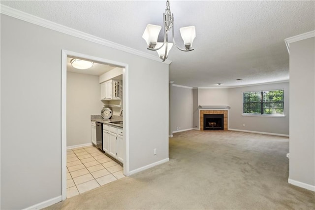 511 Barrington Hills Dr, Atlanta, GA 30350 - unfurnished living room with a textured ceiling, crown molding, light carpet, a tile fireplace, and a chandelier