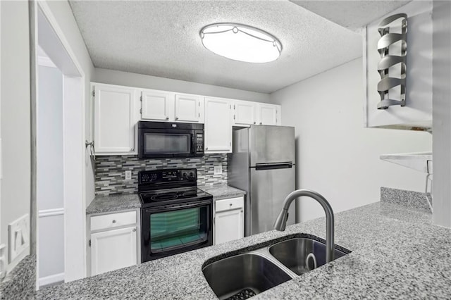 511 Barrington Hills Dr, Atlanta, GA 30350 - kitchen with black appliances, light stone counters, a textured ceiling, white cabinets, and decorative backsplash