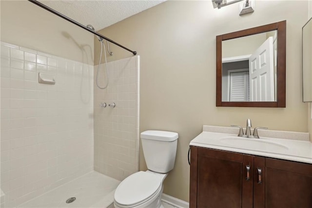 511 Barrington Hills Dr, Atlanta, GA 30350 - bathroom featuring vanity, tiled shower, and a textured ceiling