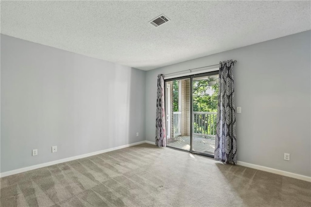 511 Barrington Hills Dr, Atlanta, GA 30350 - carpeted empty room with a textured ceiling and baseboards
