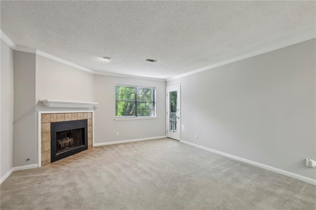 511 Barrington Hills Dr, Atlanta, GA 30350 - unfurnished living room with crown molding, a tile fireplace, carpet floors, and a textured ceiling