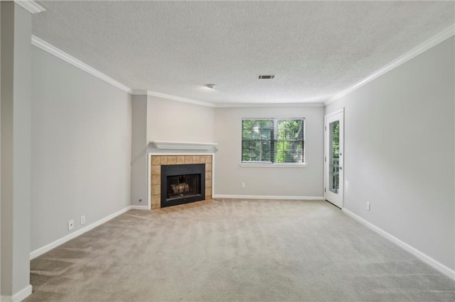 511 Barrington Hills Dr, Atlanta, GA 30350 - unfurnished living room featuring carpet flooring, ornamental molding, a textured ceiling, and a tile fireplace