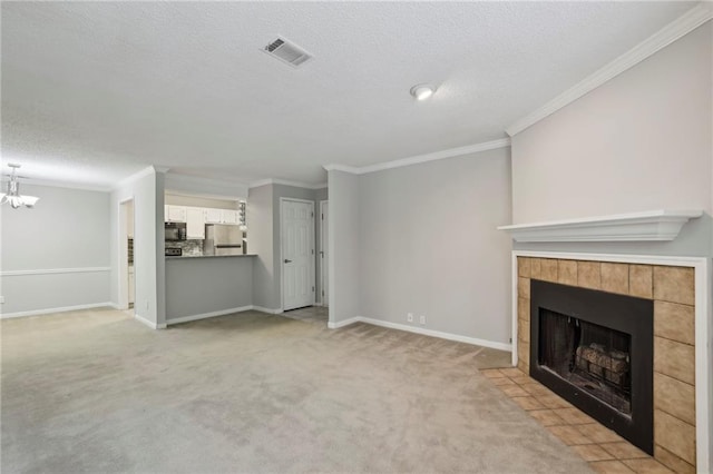 511 Barrington Hills Dr, Atlanta, GA 30350 - unfurnished living room with a tile fireplace, light carpet, ornamental molding, a textured ceiling, and a chandelier
