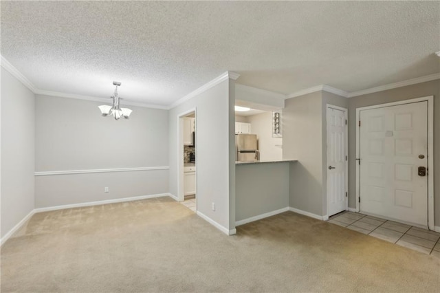 511 Barrington Hills Dr, Atlanta, GA 30350 - carpeted entrance foyer with ornamental molding, a textured ceiling, and a chandelier