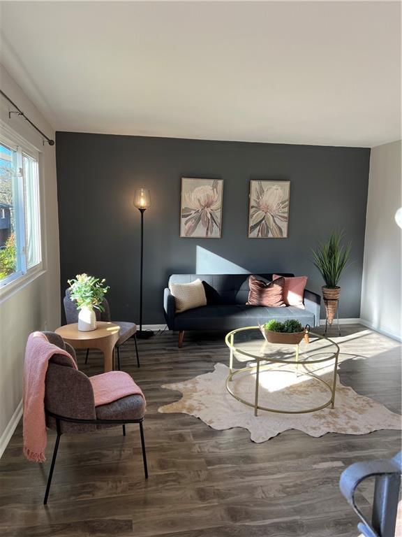 living room featuring dark wood-type flooring