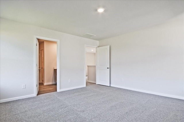 unfurnished room with carpet floors