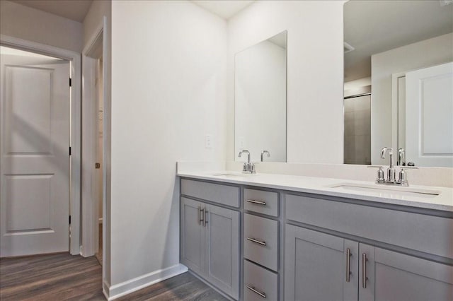 bathroom featuring vanity and hardwood / wood-style flooring