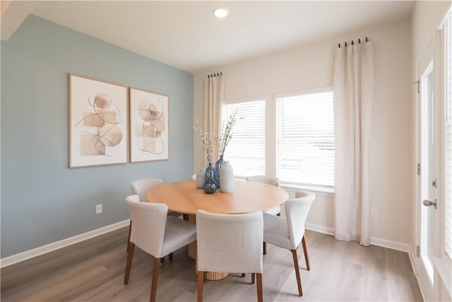 dining room with wood-type flooring