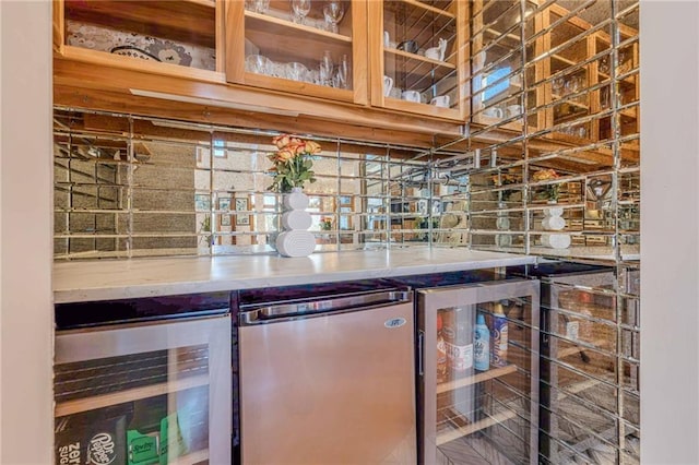 bar featuring refrigerator and beverage cooler