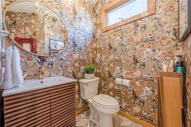 bathroom featuring toilet and vanity