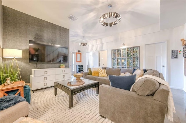 living room featuring a notable chandelier