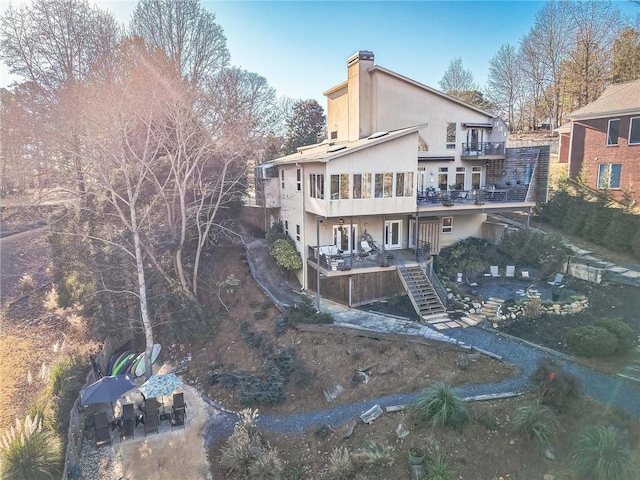 rear view of house featuring a balcony