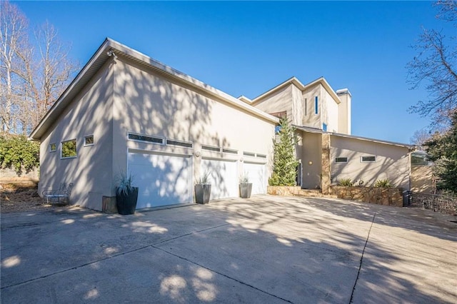 view of side of home with a garage