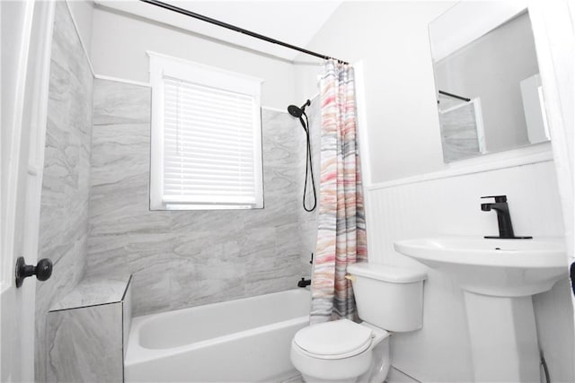 bathroom featuring toilet and shower / bath combo with shower curtain