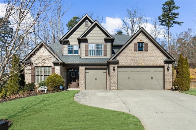 craftsman inspired home with a garage, a front lawn, concrete driveway, and brick siding