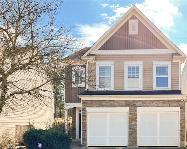 922 Gardenia Curv, Canton, GA 30114 - view of front of property with board and batten siding, an attached garage, and stone siding