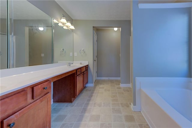922 Gardenia Curv, Canton, GA 30114 - bathroom featuring baseboards, a sink, double vanity, tile patterned flooring, and a garden tub
