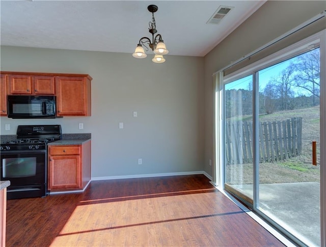 922 Gardenia Curv, Canton, GA 30114 - kitchen featuring brown cabinets, visible vents, dark wood-style floors, and black appliances
