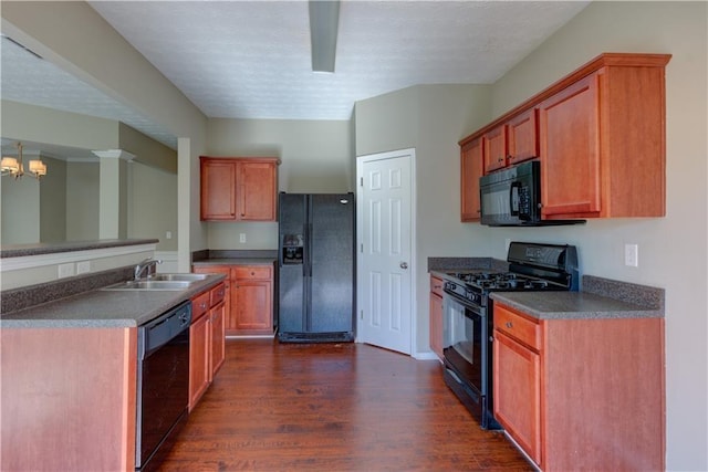 922 Gardenia Curv, Canton, GA 30114 - kitchen featuring a chandelier, dark countertops, black appliances, dark wood-type flooring, and a sink