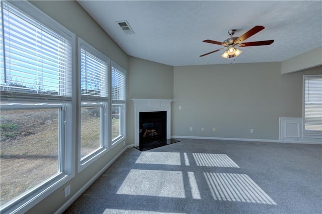 922 Gardenia Curv, Canton, GA 30114 - unfurnished living room featuring plenty of natural light, carpet flooring, visible vents, and ceiling fan