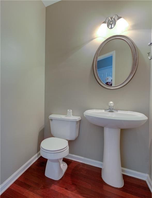922 Gardenia Curv, Canton, GA 30114 - bathroom with baseboards, toilet, and wood finished floors