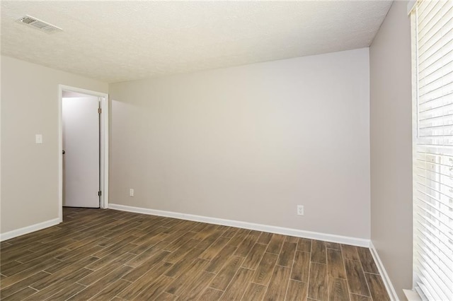 empty room featuring a textured ceiling