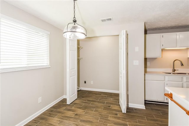 unfurnished dining area featuring sink