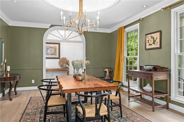 5545 Cross Gate Ct, Atlanta, GA 30327 - dining room with a chandelier, ornamental molding, light wood finished floors, and baseboards